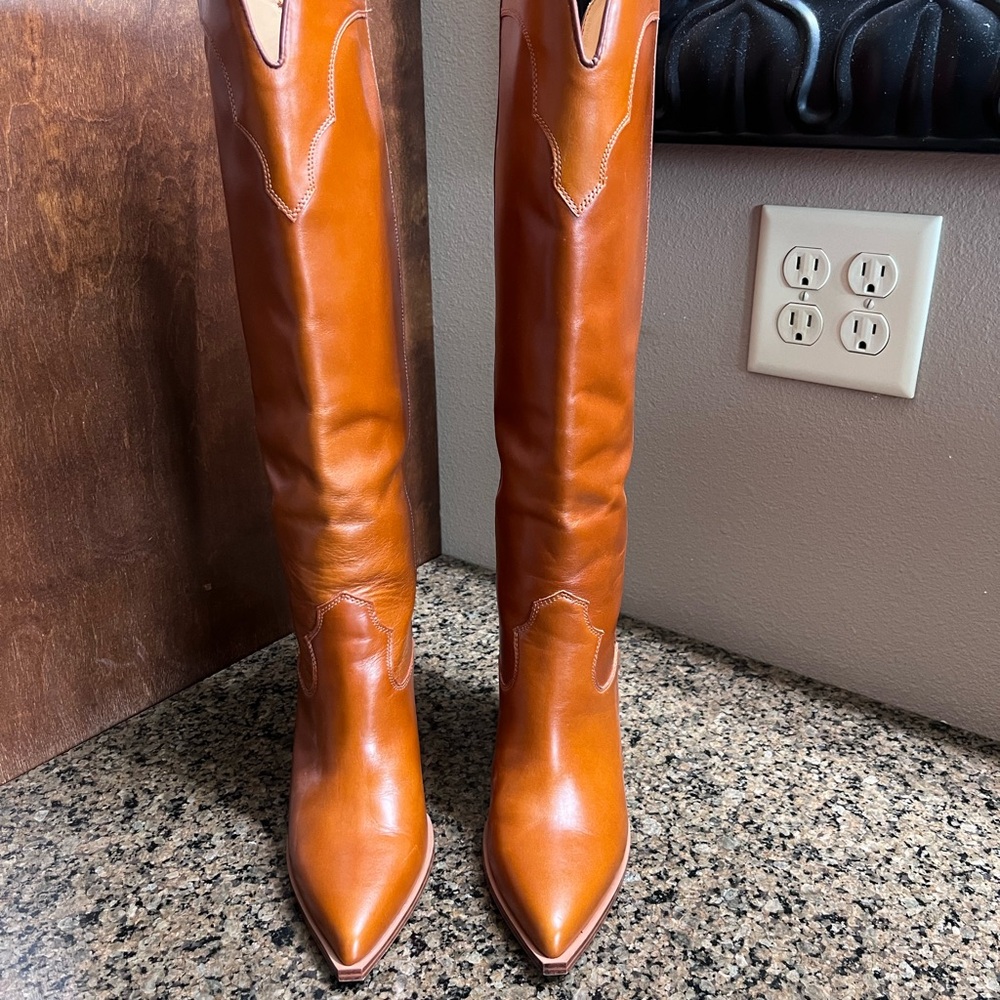 Steve Madden orange boots.